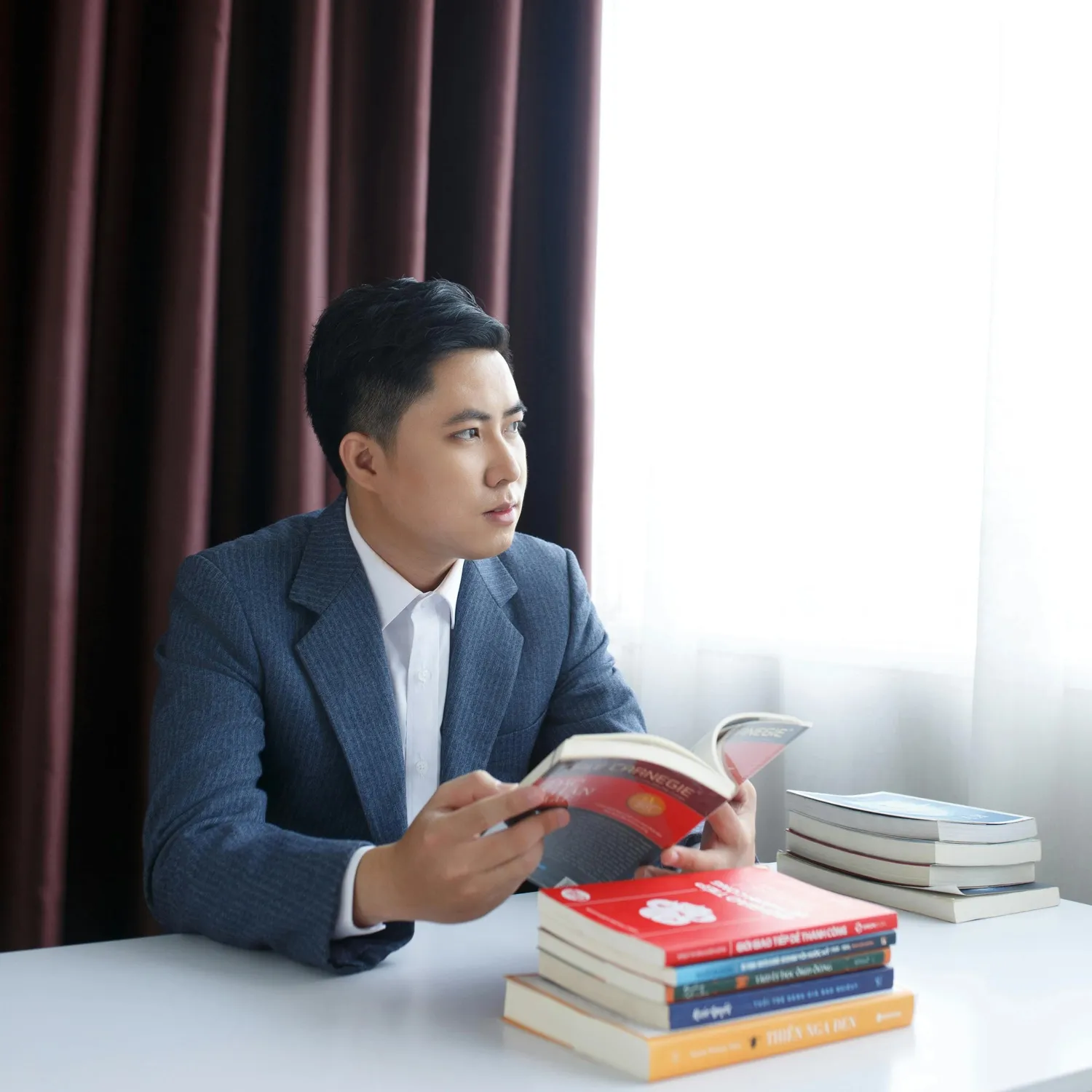 Man reading books - Academic and Business Editing and Proofreading Services in UAE